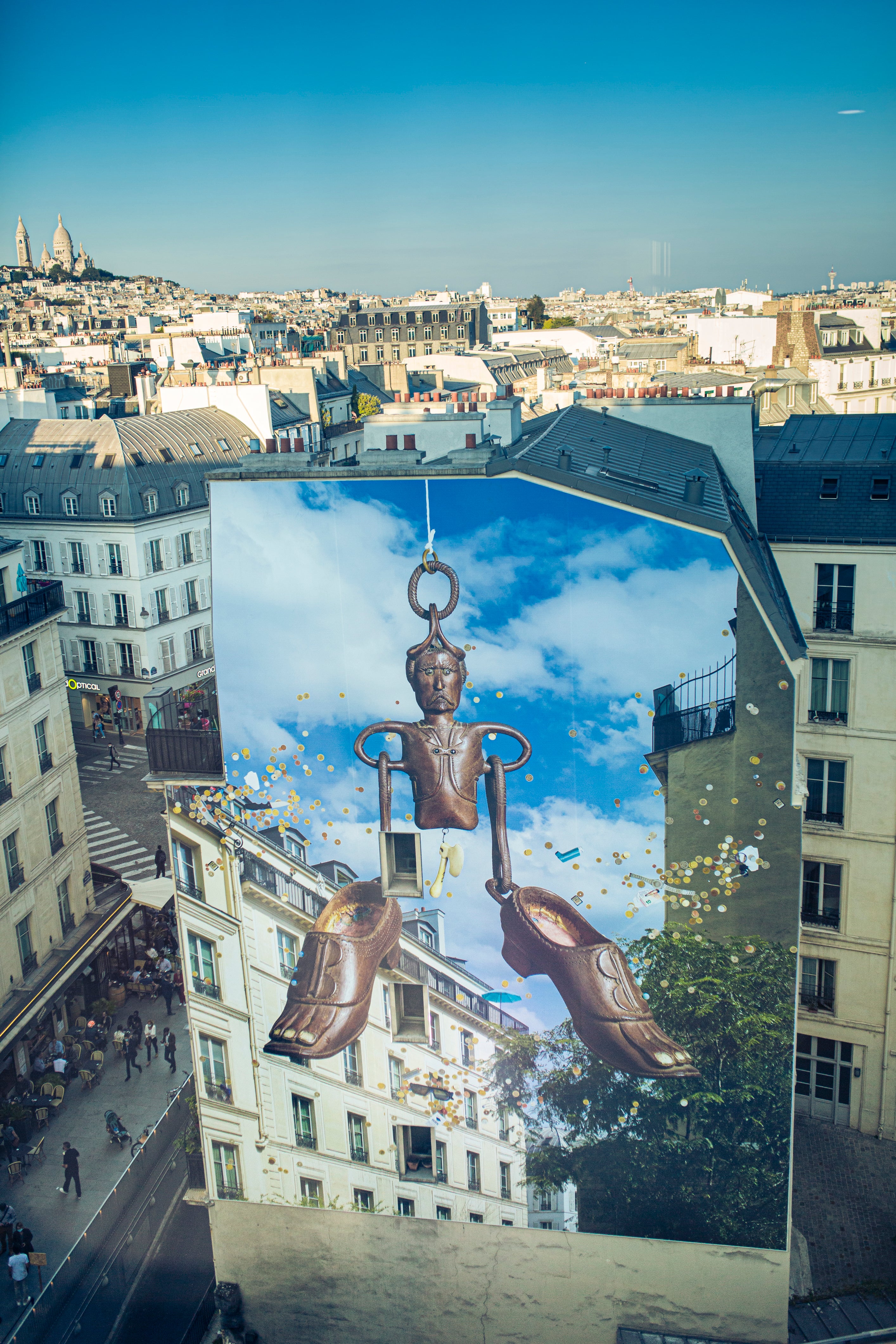 Mural on side of building with Paris skyline in background