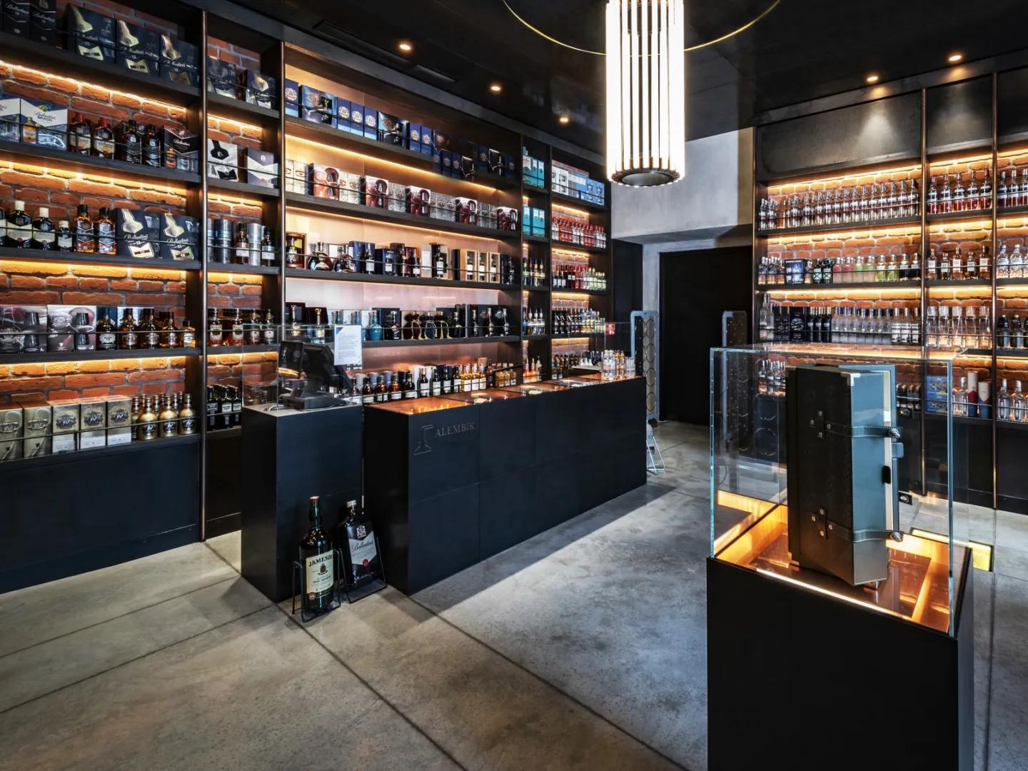 Alembik store with bottles of alcohol on shelves